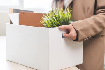 Unemployed, quite job. Desperate asian young businesswoman resigning from company, hand holding...