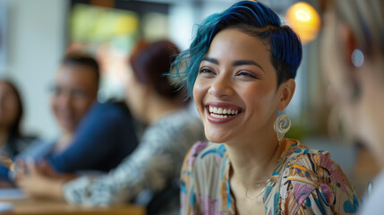 Inclusive image of happy lesbian mixed race female employee with blue cropped hair in diverse & accessible dei workplace. Pride month business marketing inclusion concept. - Powered by Adobe