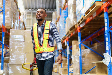 American African male warehouse worker in warehouse.