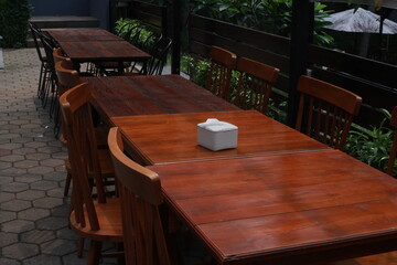 wooden tables and chairs in a cafe