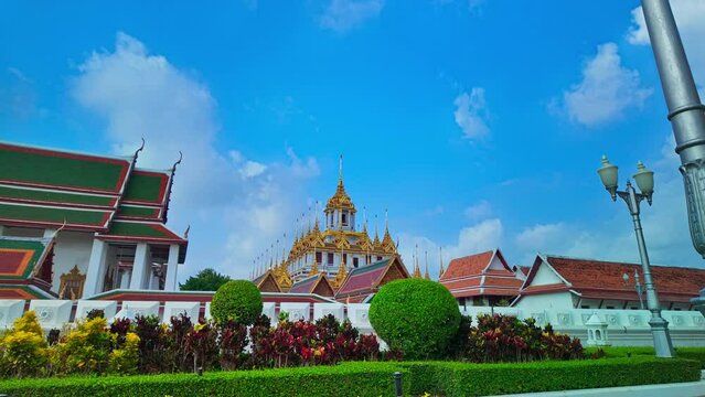 Wat Ratchanatdaram Worawihan (Loha Prasat).The Loha Prasat is an amazing building with an iron roof made of 37 spires signifying the 37 enlightenment virtues of Buddhism.The spiers of golden castle