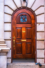 Period wooden arched door surrounded by custom stonework in Staunton, Virginia, USA