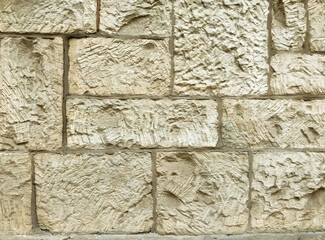A wall made of stone with a rough texture