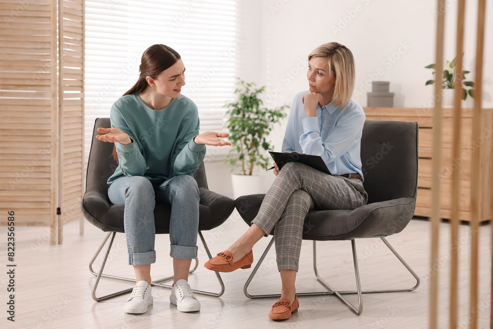 Canvas Prints Professional psychotherapist working with patient in office