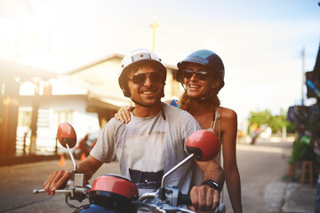 Motorbike, travel and happy couple on street with helmet for vacation together, road trip and love...