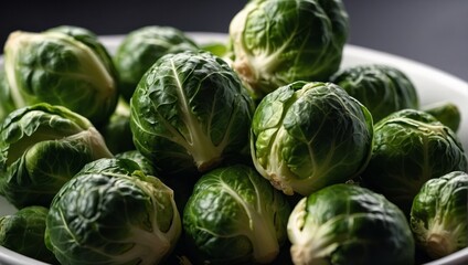 Fototapeta premium Close up of fresh green Brussels sprouts on white background. Organic vegetable, healthy food, vegan diet concept.