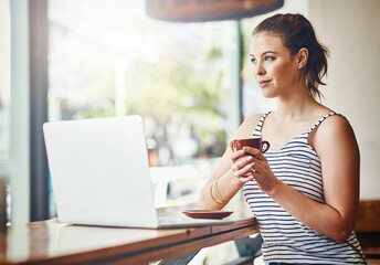 Woman, thinking and freelance remote work in cafe with laptop for online research as copywriter....