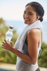 Woman, portrait or water with headphones in nature for exercise, listening or streaming for...