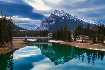 Moody Clouds Over The Banff River