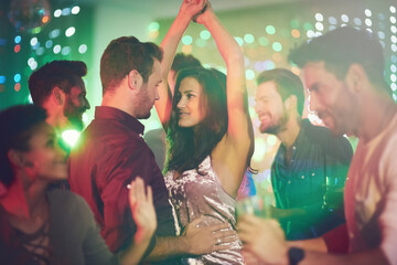 Couple, dance and celebrate in club at night on date with love in marriage or relationship....