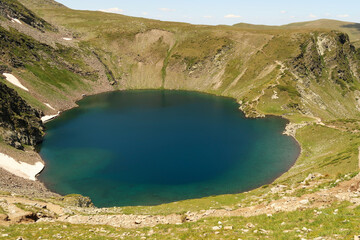 Spectacular view onto the deep blue Eye, Okoto Lake, one of the Seven Rila Lakes, situated on a...