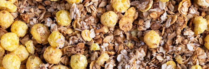 Organic roasted crispy granola cereal with oatmeal and flaxseed flakes and crunchy corn balls and...