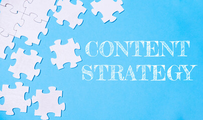 A jigsaw puzzle with the word content strategy written on it
