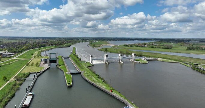 Aerial drone view on hydroelectric power plant in The Netherlands. Generation of electric energy by the flow of water.