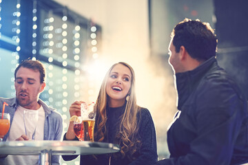 Friends, group and nightclub with alcohol drinks or relax conversation for weekend fun, cocktail or event. Men, woman and party concert or birthday celebration for socialising, new years or gathering