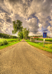 Big clouds floating over a rustic landscape in The Netherlands.