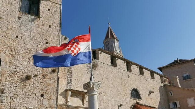 Croatian flag in the city center of Trogir on a sunny day, Croatia