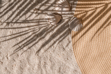 Aesthetic summer vacation and resort background, straw hat and sea shells on light beige neutral...