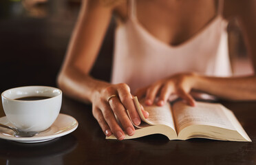 Hands, student and reading book in coffee shop for story, knowledge and person learning literature...