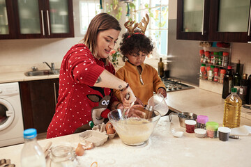 Mother, boy and baking with christmas, love and dough learning for cookies in kitchen together....