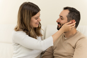 Young couple gazes at each other with deep love