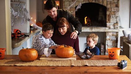 Happy family, home and children with pumpkin for halloween to celebrate with siblings, parents or...