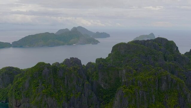 Secret Lagoon and Jiji's Beach, drone view. Miniloc Island. Islands in El Nido, Palawan. Philippines.