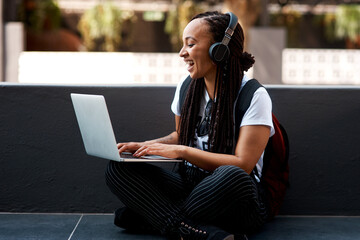 Woman, student and headset or laughing with laptop, typing and online classes for elearning or...