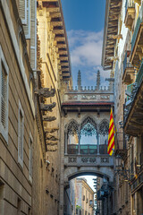 Carrer del Bisbe street with Bishop Bridge in Gothic Quarter, Barcelona, Spain