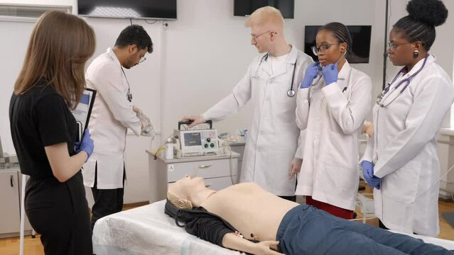 Doctors performing procedure on patient