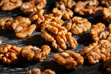 walnuts on black wood background