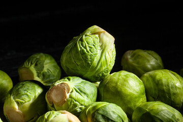 brussels sprouts on black background