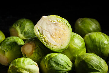 sliced brussels sprouts on black background