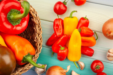 mini bell pepper mix on wood background top view