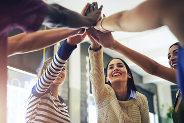 Group diversity, circle and high five for friendship, teamwork and success in cafe or restaurant. Friends, students and young creatives in diner for support, brainstorm and collaboration or ideas
