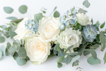 Small bouquet with white and light blue flowers on white background