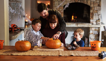 Happy family, parents and children with pumpkin for halloween to celebrate with siblings, pirate or...