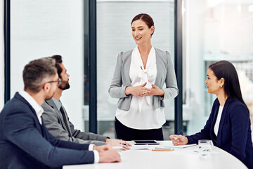 Business people, planning and meeting on table for discussion, team and strategy in office. Group, employees and teamwork, collaboration or brainstorming for project in corporate conference room