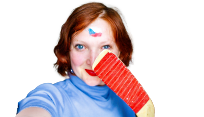 Portrait of czech woman, fan of czech hockey czech team, world championship in the Czech republic, Czechia, 2024, selfie, czech flag on forehead and hockey stick at the white background