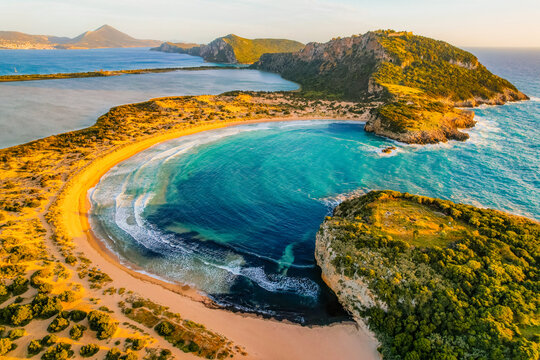 Aerial view of voidokilia beach, lagoon with beaches in mediterranean, Ionian Sea, Pylos town , Greece. Navarino Castle on hill.