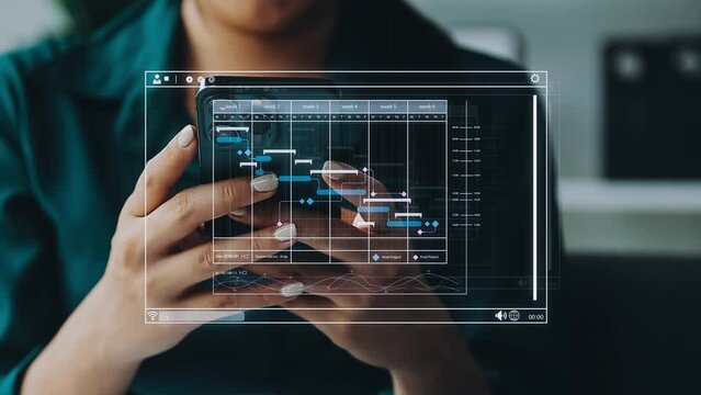 Project manager working with Gantt chart schedule to plan tasks and deliverables. Scheduling activities with a planning software, Corporate strategy for finance, operations, sales, marketing.