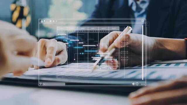 Project manager working with Gantt chart schedule to plan tasks and deliverables. Scheduling activities with a planning software, Corporate strategy for finance, operations, sales, marketing.