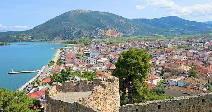 Vonitsa town in Greece, panorama of the picturesque seaside town with Ambracian Gulf, hills and traditional architecture seen from the Venetian fortress.