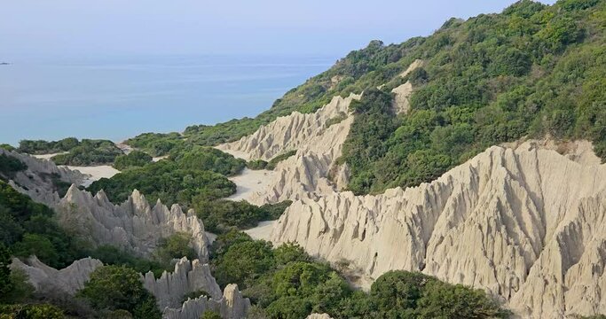 White Sandstone Mountains panorama on the Gerakas Beach on the southern coast of Zakynthos, clay rock formations overgrown with bushes, Greece.