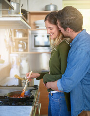 Happy, couple and cooking with hug in kitchen for food preparation, nutrition and romantic meal at home. Smile, man and woman with stew or soup for balanced diet, .bonding and support on anniversary