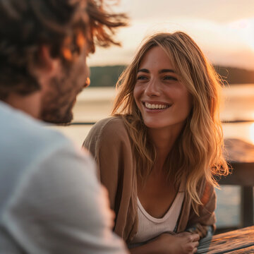 Couple in love at sunset at a romantic dinner