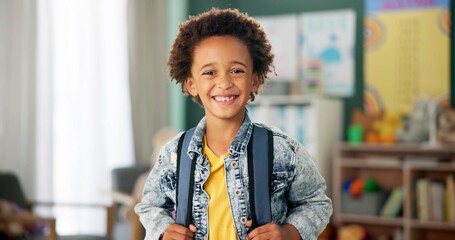 Smile, face and student in classroom for education, learning and ready for morning kindergarten. Happy, school and portrait of boy or child with knowledge, studying and pride for academic lesson