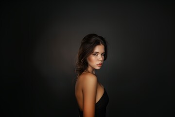 Fototapeta premium A woman in a stylish business suit with a fashionable haircut, smiling, strict makeup.
