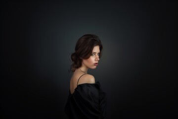 Obraz premium A woman in a stylish business suit with a fashionable haircut, smiling, strict makeup.