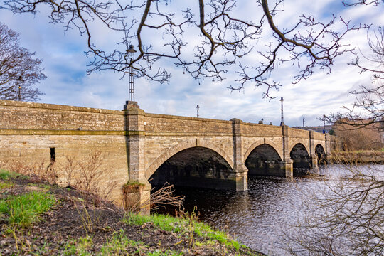 Arched stone bridge over the river in winter at Thurso, Scotland